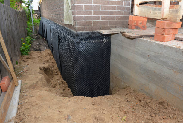 Happy homeowners after waterproofing job in Toms River